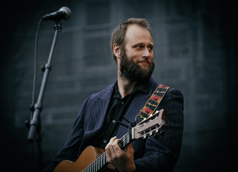 A guy playing a guitar